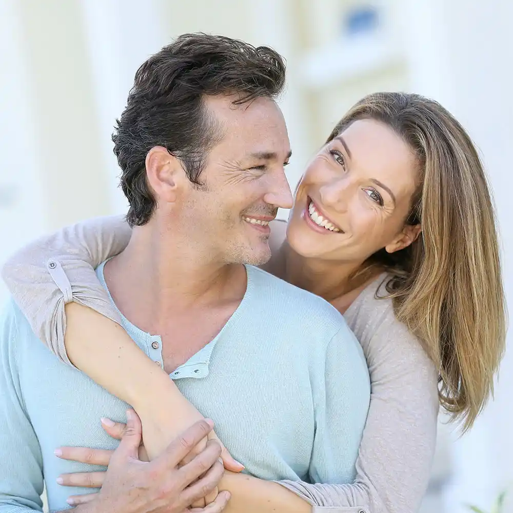ed_img A couple smiling and hugging, after Sexual Dysfunction treatment by Greyledge Technologies, Miami, FL.