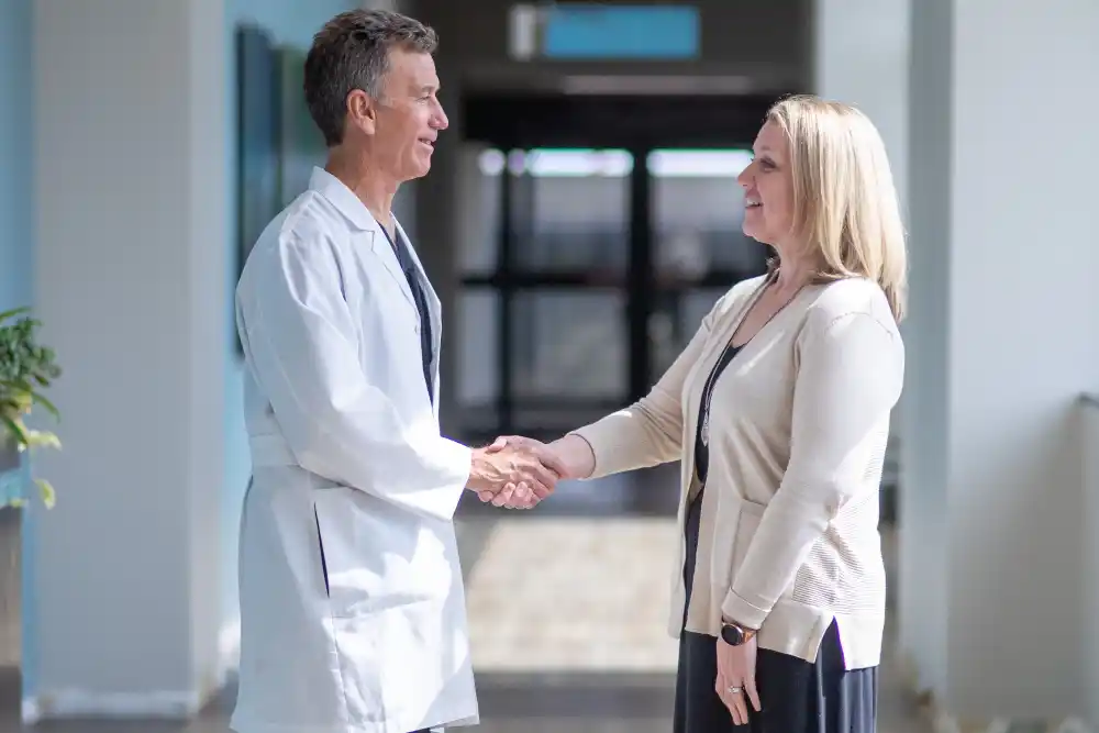 service-areas-best-treatment-available Doctor Shaking Hands with Woman